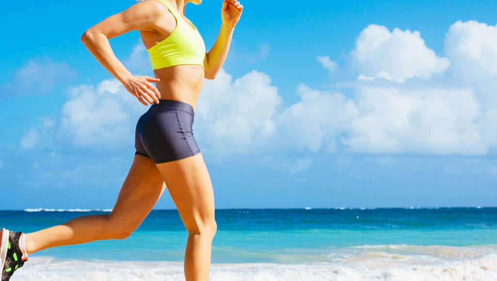 A woman running along the beach